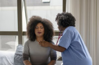 Nurse examining transgender woman